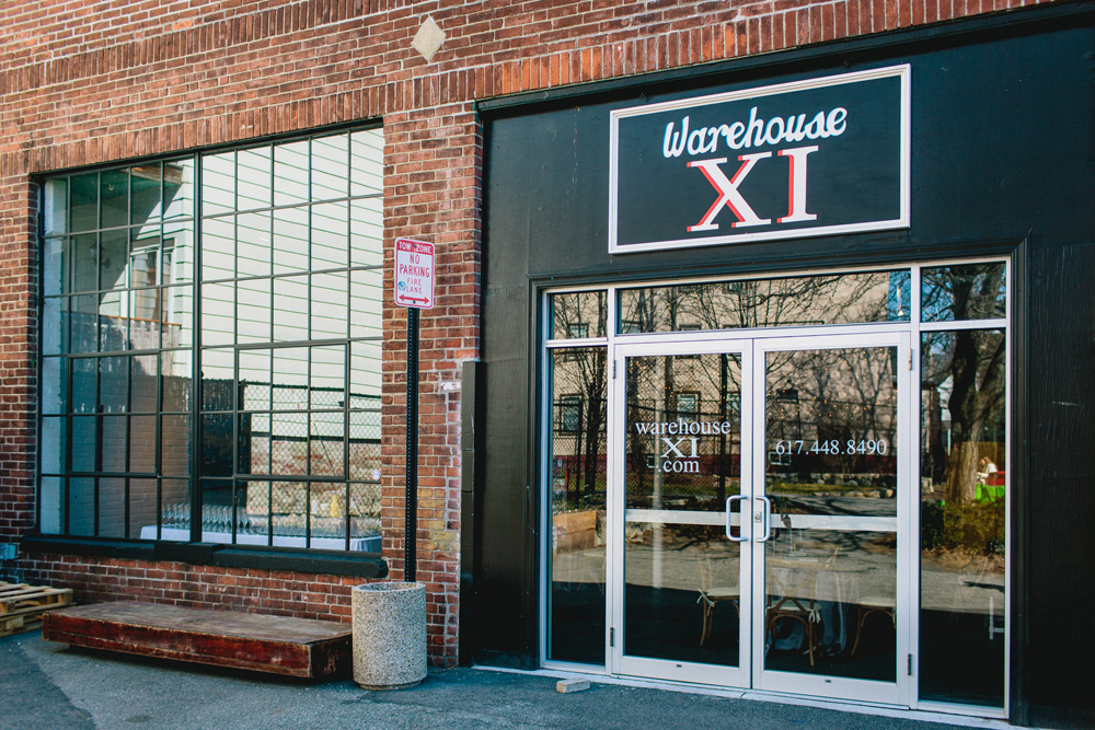 A storefront with a sign that says warehouse xi.